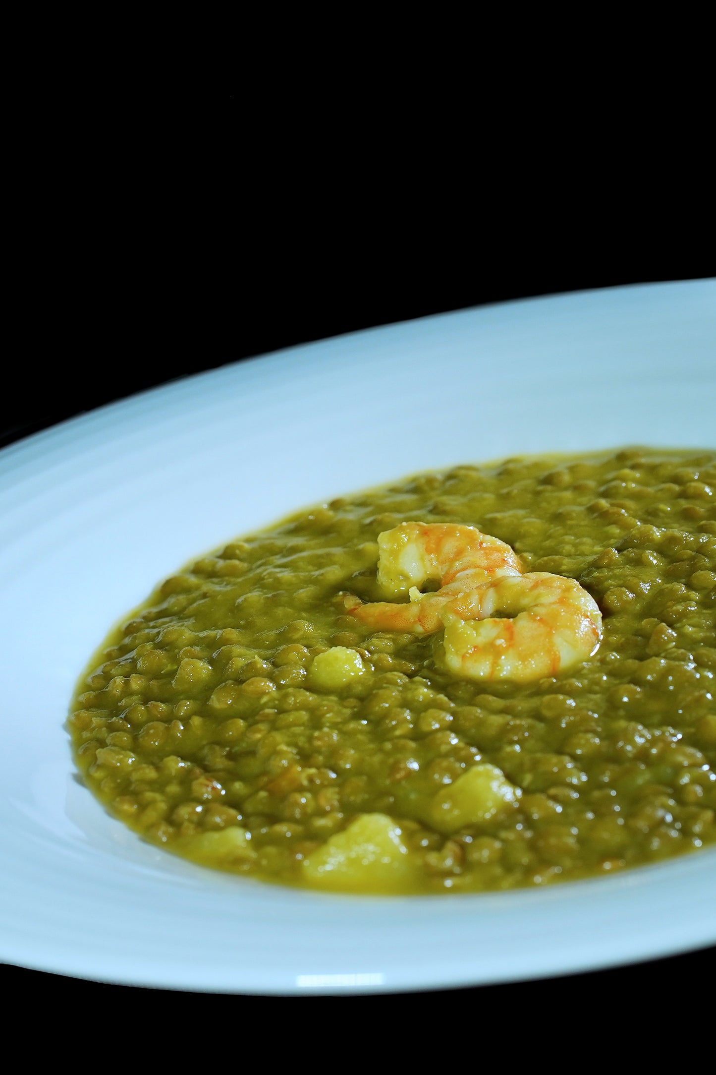 Lentejas al curry con gambón