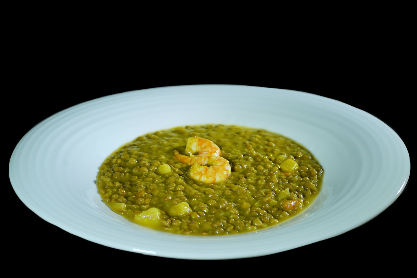 Lentejas al curry con gambón